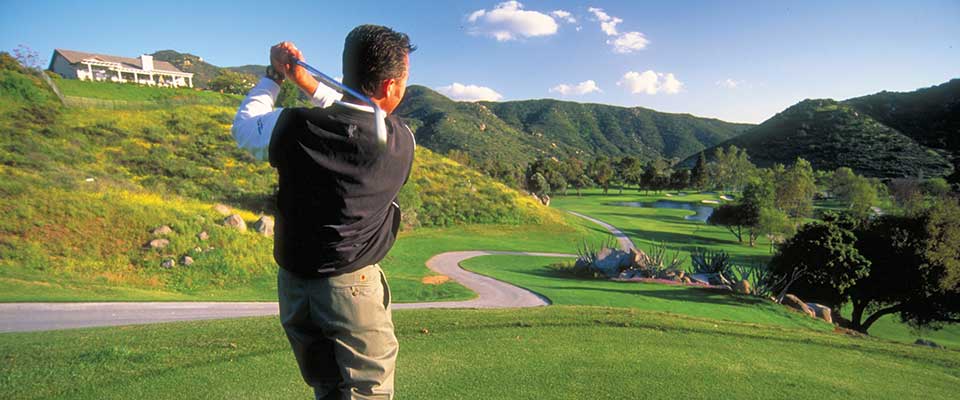 Sycuan Resort, golfer taking a swing. San Diego, California.