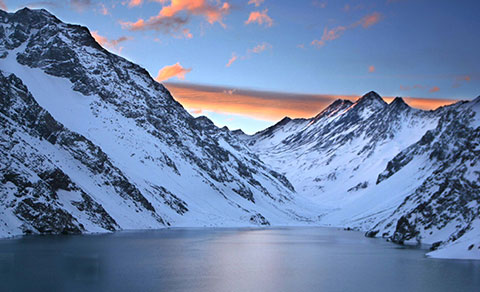 Beautiful sunset over the snowy mountains. Chile.